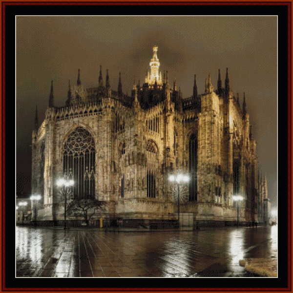 Counted Cross Stitch Pattern by Cross Stitch Collectibles of the Duomo di Milano, a famous cathedral in Milan, Italy, at night with lights on, viewed from a distance.