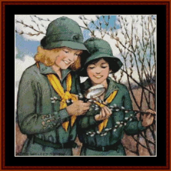 Two children in green scout uniforms looking through a magnifying glass outdoors - Counted Cross Stitch Pattern by Cross Stitch Collectibles