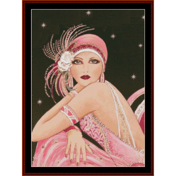 Art Deco-style Counted Cross Stitch Pattern by Cross Stitch Collectibles of a woman with a pink headpiece and dress against a starry night sky.