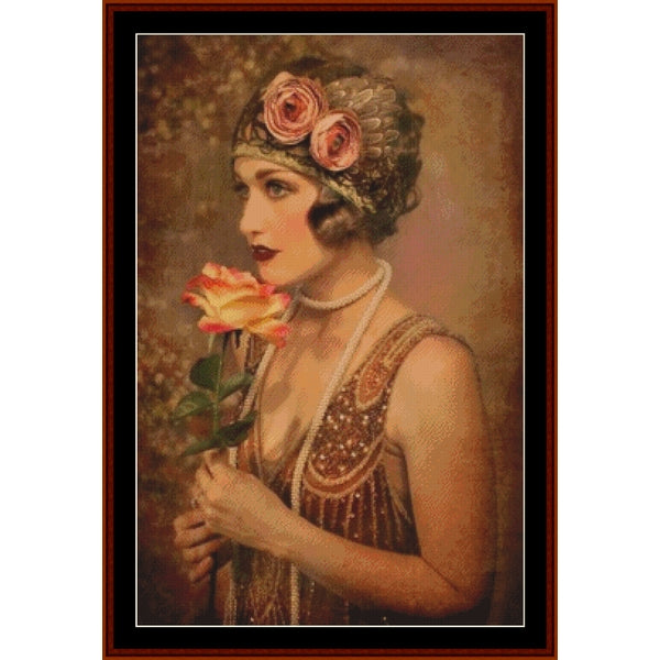 Vintage-style Counted Cross Stitch Pattern by Cross Stitch Collectibles of a woman holding a rose with a decorative headband.