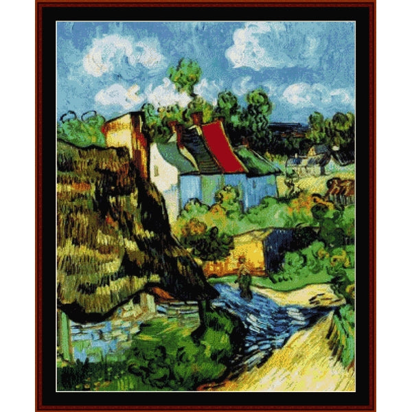Counted Cross Stitch Pattern by Cross Stitch Collectibles of a village scene with houses and a river, framed in brown.
