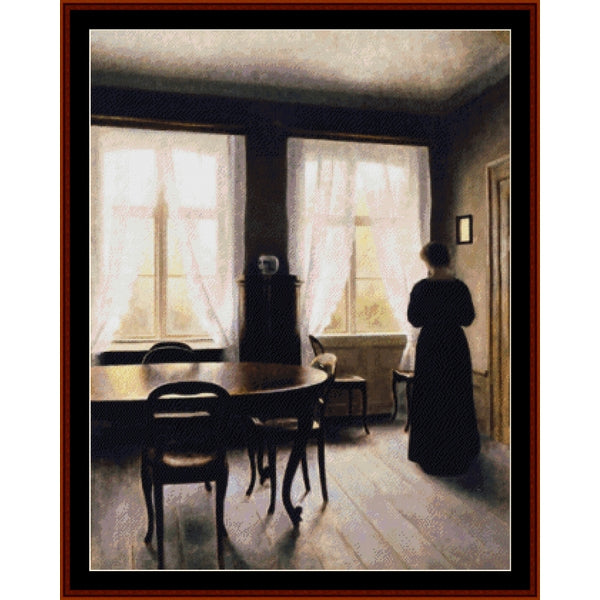 Counted Cross Stitch Pattern by Cross Stitch Collectibles of a woman in a room with large windows and a dining table.