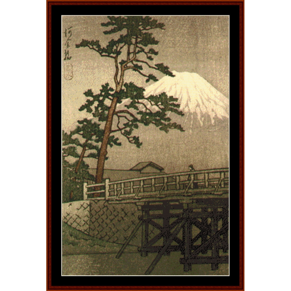 Counted Cross Stitch Pattern by Cross Stitch Collectibles of Mount Fuji with a bridge and pine tree, framed in brown.