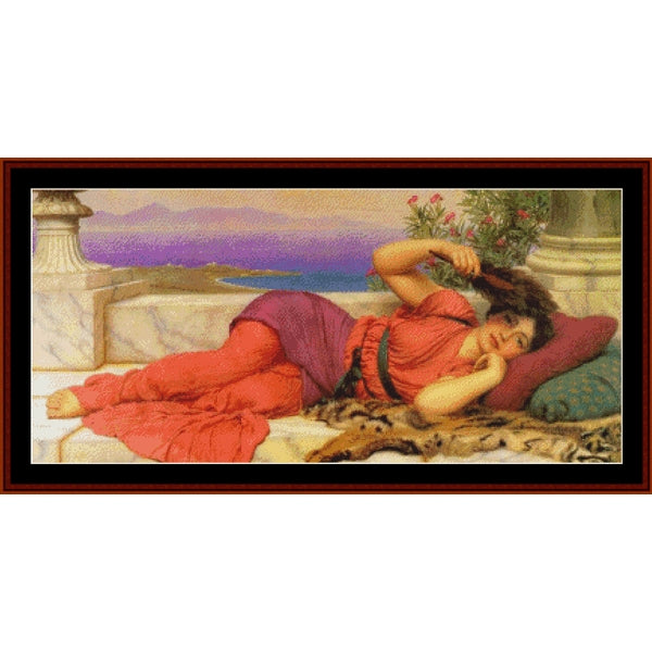 Counted Cross Stitch Pattern: Noon Day Rest, 1910 by J.W. Godward - Cross Stitch Collectibles - A framed classical painting depicting a reclining woman in red and purple garments on a stone terrace with a purple sea and mountains in the background