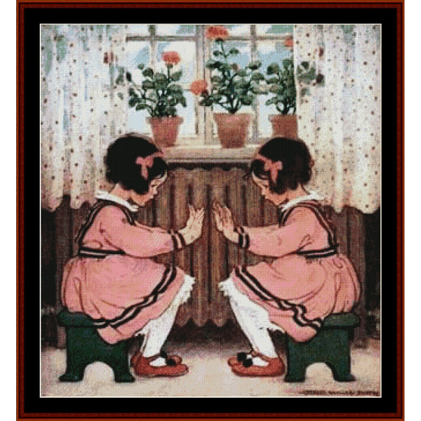 Counted Cross Stitch Pattern: Pat-a-Cake by Jesse Willcox Smith - Cross Stitch Collectibles - A framed vintage-style illustration showing two young girls in pink dresses sitting on stools and facing each other with open hands, set in a room with curtains, potted flowers, and a window.