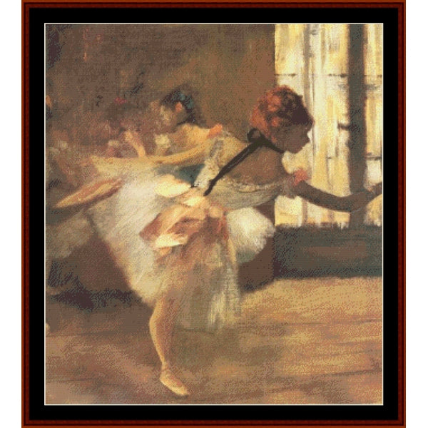 Counted Cross Stitch Pattern – Repetition of the Dance, Detail by Edgar Degas - Cross Stitch Collectibles - A framed art print depicting an impressionistic ballerina in a white tutu within a warm-toned studio