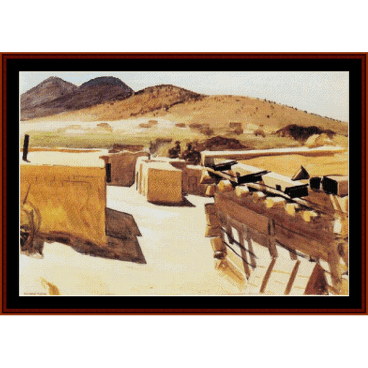 Counted Cross Stitch Pattern by Cross Stitch Collectibles - Desert landscape with mountains and a large rectangular object, possibly a monument or sculpture.