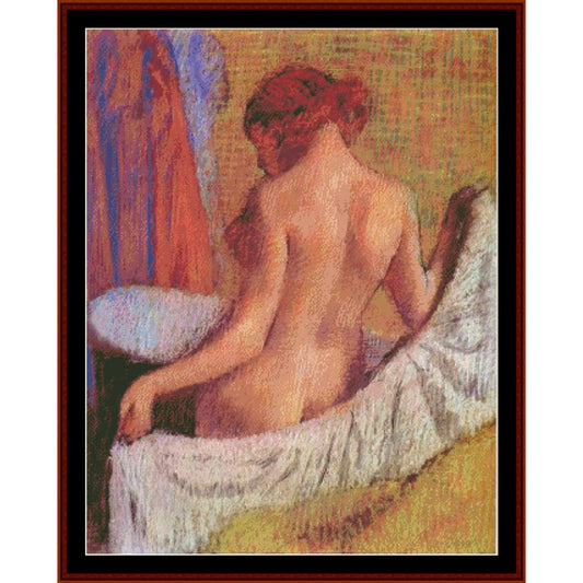 Counted Cross Stitch Pattern by Cross Stitch Collectibles of a nude figure sitting on a towel with a colorful curtain in the background.
