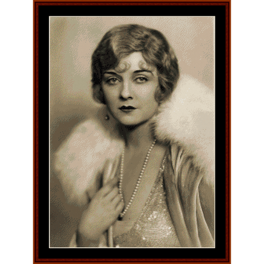 Counted Cross Stitch Pattern by Cross Stitch Collectibles - Vintage-style portrait of a woman with a feathered boa and pearl necklace, framed in brown.