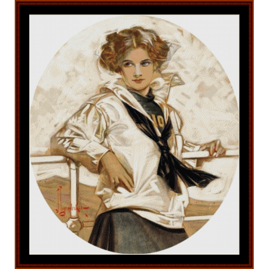 Vintage-style Counted Cross Stitch Pattern by Cross Stitch Collectibles of a woman in a white coat with a black sash, standing on a boat.