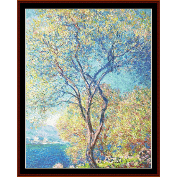 Counted Cross Stitch Pattern by Cross Stitch Collectibles depicting a tree with a blue sky in the background, framed in a black frame.
