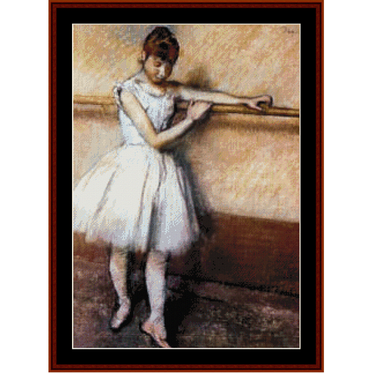 Counted Cross Stitch Pattern by Cross Stitch Collectibles of a young girl in a white ballet outfit with her hand on a ballet barre