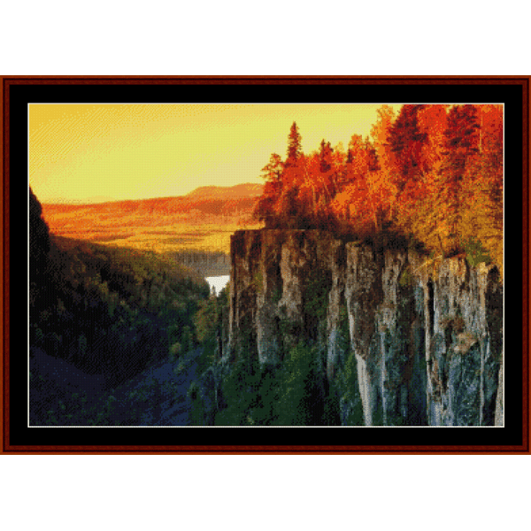 Counted Cross Stitch Pattern by Cross Stitch Collectibles depicting a scenic view with autumn-colored trees on a cliff edge.