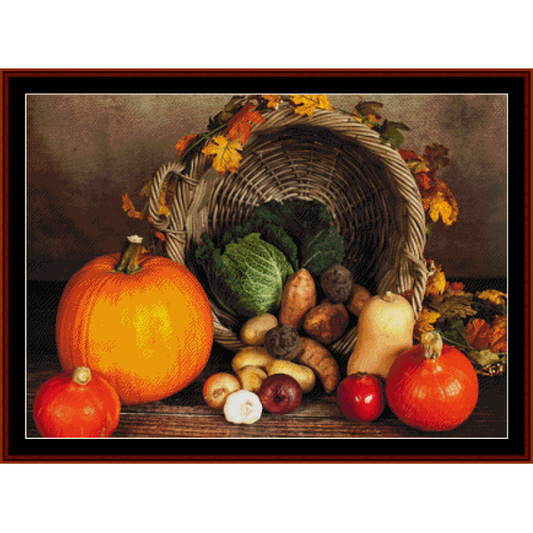Counted Cross Stitch Pattern by Cross Stitch Collectibles featuring a basket of autumn-themed vegetables and a pumpkin, with a background of leaves.