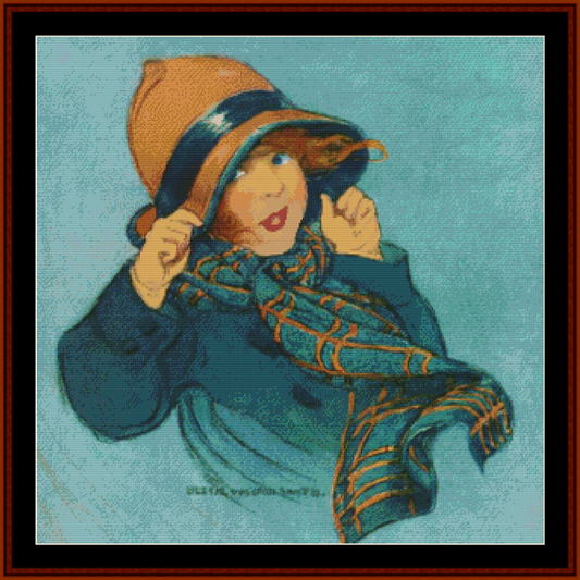 Counted Cross Stitch Pattern by Cross Stitch Collectibles depicting a child wearing a hat and a scarf, with a blue jacket and brown hat.