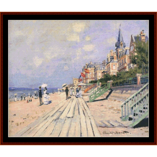 Cross Stitch Pattern by Cross Stitch Collectibles of a beach scene with people and a building in the background
