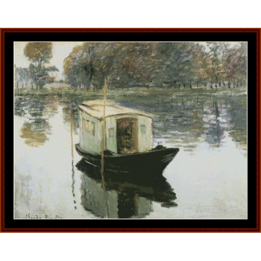 Cross Stitch Pattern by Cross Stitch Collectibles of a boat on a calm lake with trees in the background