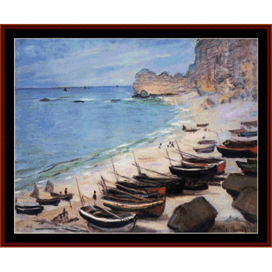Counted Cross Stitch Pattern by Cross Stitch Collectibles depicting 'Boats on the Beach at Etretat' by Claude Monet, with boats anchored off the coast near a rocky shore.
