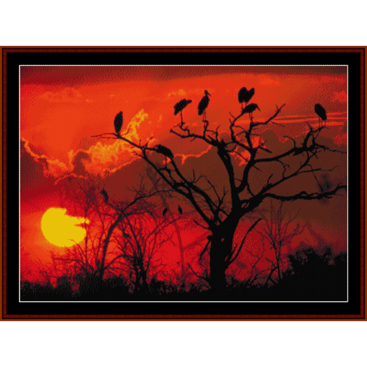 Counted Cross Stitch Pattern by Cross Stitch Collectibles depicting a sunset with birds perched on trees.