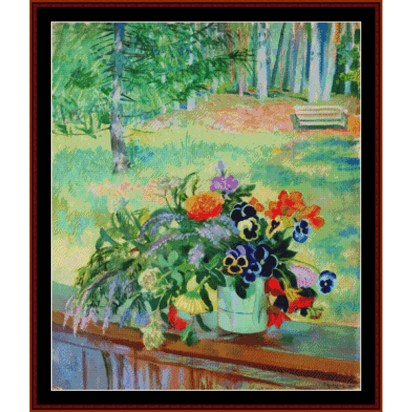 Counted Cross Stitch Pattern by Cross Stitch Collectibles depicting a bouquet of flowers arranged on a balcony, with a mix of colorful flowers in a white vase, set against a blurred background of a garden or park setting.