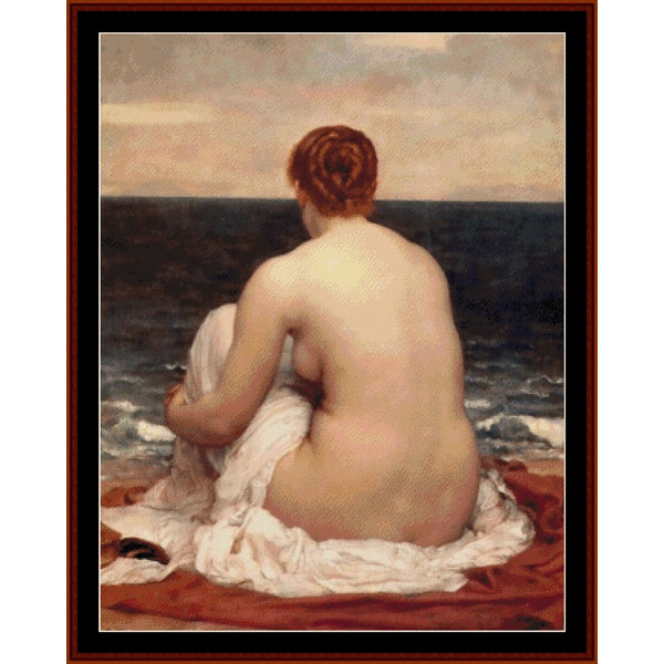 Counted Cross Stitch Pattern - Psamathe by Frederick Leighton - Cross Stitch Collectibles - A framed classical painting depicting a nude woman seated on a beach with her back to the viewer, facing the ocean under a cloudy sky. 