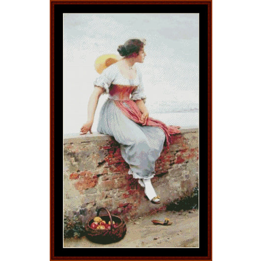 Counted Cross Stitch Pattern: A Pensive Moment by Eugene de Blass- Cross Stitch Collectibles - A framed vintage-style painting showing a woman in a white dress and red sash leaning on a stone wall by the water, with a basket of fruit at her feet. 