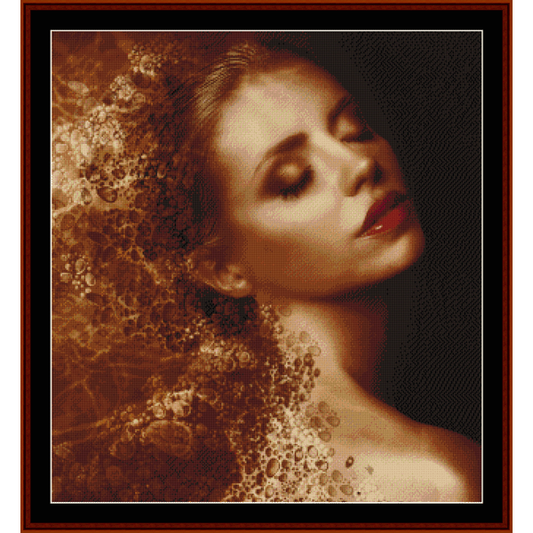 Counted Cross Stitch Pattern by Cross Stitch Collectibles of a woman with flowing hair in a brown and white color palette.