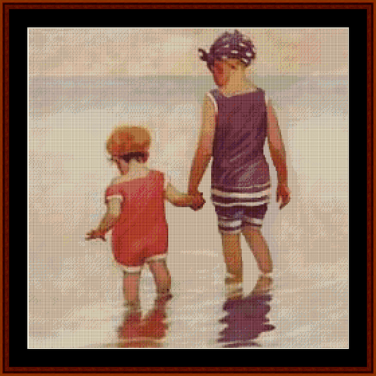 Counted Cross Stitch Pattern by Cross Stitch Collectibles depicting two children at the beach, with one child in a red swimsuit and the other in a purple swimsuit, holding hands and looking out at the ocean.