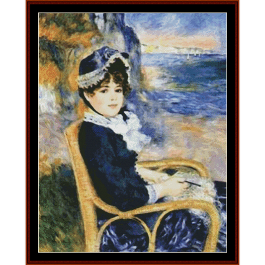 Counted Cross Stitch Pattern by Cross Stitch Collectibles featuring a woman seated by a body of water, possibly the sea, with a mountainous background. She is wearing a black and gray outfit and sitting in a chair.