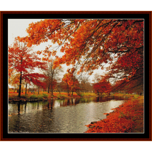 Counted Cross Stitch Pattern by Cross Stitch Collectibles depicting a autumnal scene with orange trees and a canal.