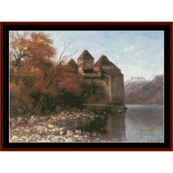 Counted Cross Stitch Pattern – Chateau de Chillon by Gustave Courbet - Cross Stitch Collectibles - A framed landscape painting depicting a stone castle beside a calm lake, with autumn trees, rocky shore, and distant mountains under a pale sky.