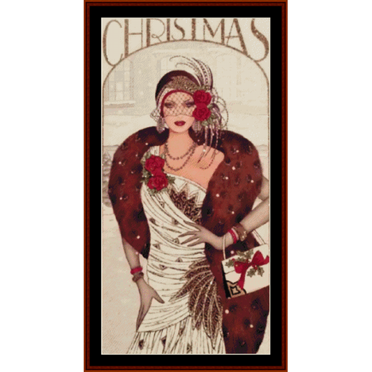 Counted Cross Stitch Pattern by Cross Stitch Collectibles featuring a vintage style Christmas illustration with a woman in a glamorous outfit, including a fur coat and a wide-brimmed hat, carrying a red purse and a Christmas tree.