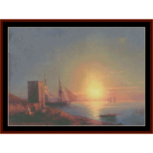 Counted Cross Stitch Pattern – Coastal Landscape at Sunset by Ivan Aivazovsky - Cross Stitch Collectibles - A framed seascape artwork showing a sunset over calm water with a large sailing ship, a small boat, and a rocky shoreline with a tower on the left.