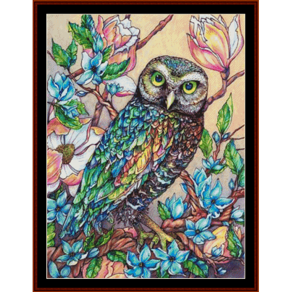 Counted Cross Stitch Pattern by Cross Stitch Collectibles of an owl perched on a branch with flowers in the background, indicating the product's detailed and artistic design.