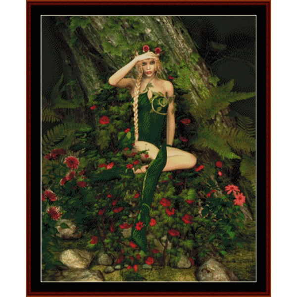 Fairy in a green dress sitting among flowers and foliage  - Counted Cross Stitch Pattern by Cross Stitch Collectibles