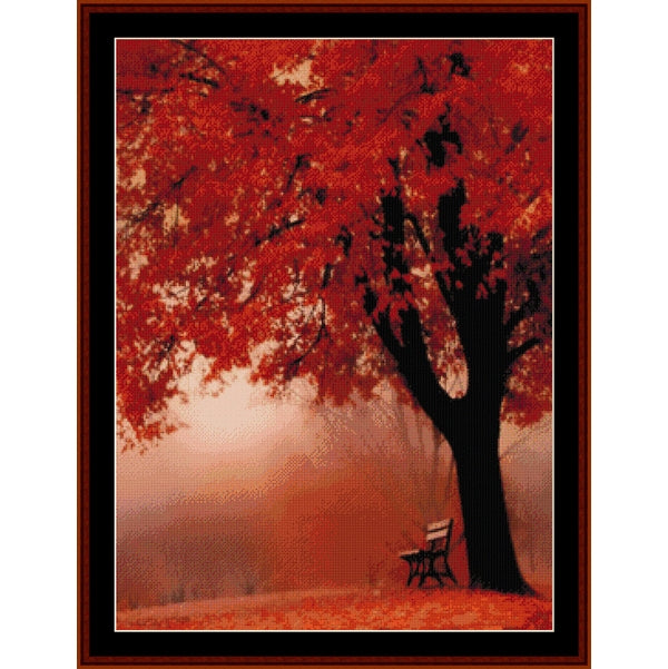 Counted Cross Stitch Pattern by Cross Stitch Collectibles of a tree with red leaves and a bench in a misty forest