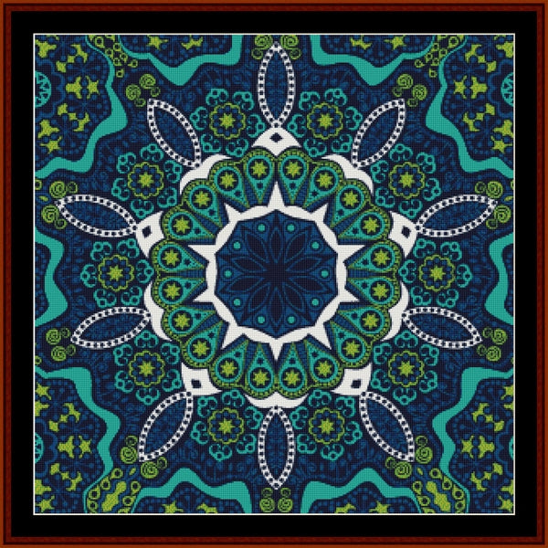 Mandala Counted Cross Stitch Pattern by Cross Stitch Collectibles with blue, green, and white colors on a dark blue background.