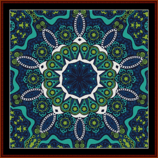 Mandala Counted Cross Stitch Pattern by Cross Stitch Collectibles with blue, green, and white colors on a dark blue background.