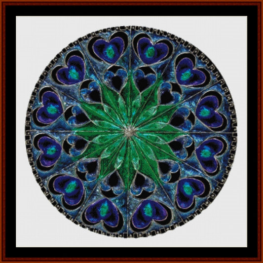 Mandala Counted Cross Stitch Pattern by Cross Stitch Collectibles with blue and green colors on a white background