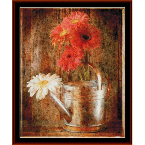 Vintage-style Counted Cross Stitch Pattern by Cross Stitch Collectibles of flowers in a watering can on a textured background