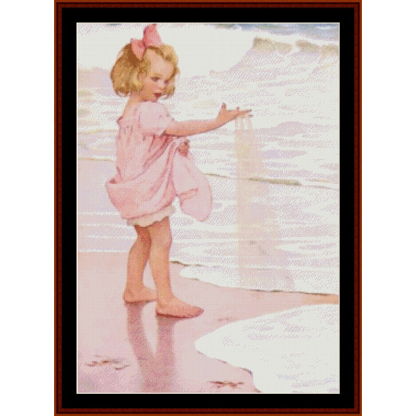 Counted Cross Stitch Pattern by Cross Stitch Collectibles of a young girl in a pink dress standing on a beach.