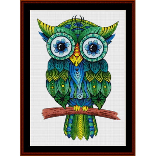 Colorful owl Counted Cross Stitch Pattern by Cross Stitch Collectibles on a white background with a wooden frame.