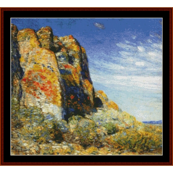 Counted Cross Stitch Pattern by Cross Stitch Collectibles of a rocky landscape with a blue sky