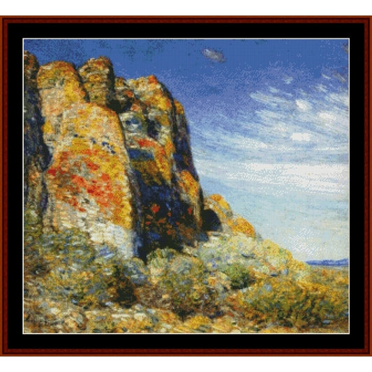 Counted Cross Stitch Pattern by Cross Stitch Collectibles of a rocky landscape with a blue sky