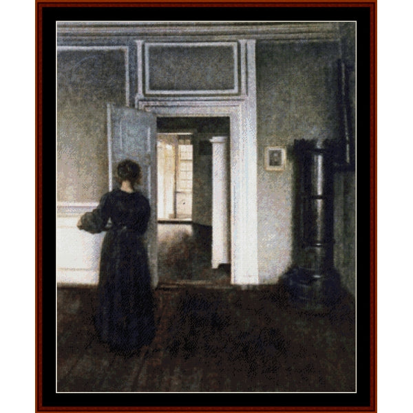 Counted Cross Stitch Pattern by Cross Stitch Collectibles - Woman in a dark dress standing in a room with an open door