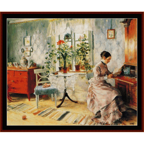 Counted Cross Stitch Pattern by Cross Stitch Collectibles - Woman sitting at a desk in a room with flowers and furniture