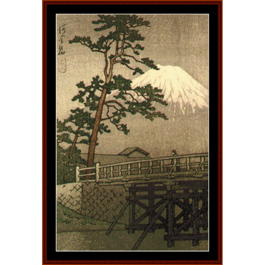 Counted Cross Stitch Pattern by Cross Stitch Collectibles of Mount Fuji with a bridge and pine tree, framed in brown.