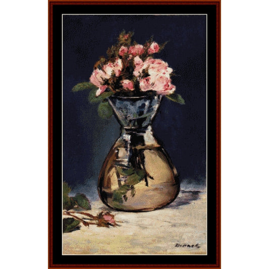 Counted Cross Stitch Pattern: Moss Roses in Vase by Edouard Manet - Cross Stitch Collectibles - A framed still life painting featuring pink roses in a reflective glass vase against a dark navy background, with a white mat and a reddish-brown wooden frame.