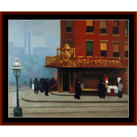 Counted Cross Stitch Pattern: New York Corner by Edward Hopper - Cross Stitch Collectibles - A framed art print depicting a city street corner scene with a red brick building, a gold balcony, a streetlamp, and several small figures in dark clothing