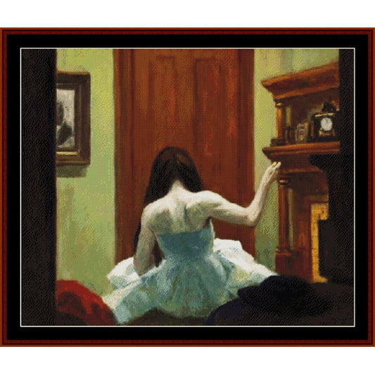 Counted Cross Stitch Pattern: New York Interior, 1921 by Edward Hopper - Cross Stitch Collectibles - A framed art print depicting a woman in a white dress seen from behind, standing in a room with a brown wooden door and fireplace.